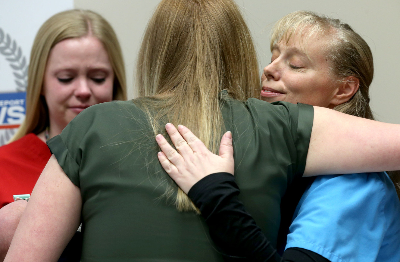 Medical laboratory scientist Lauren Fredrickson, left and Jana Scott from the blood bank, right, hug Arlee Gregerson, center, at the Intermountain Medical Center in Murray on Thursday, Dec. 17, 2015. (Photo: Laura Seitz, Deseret News)