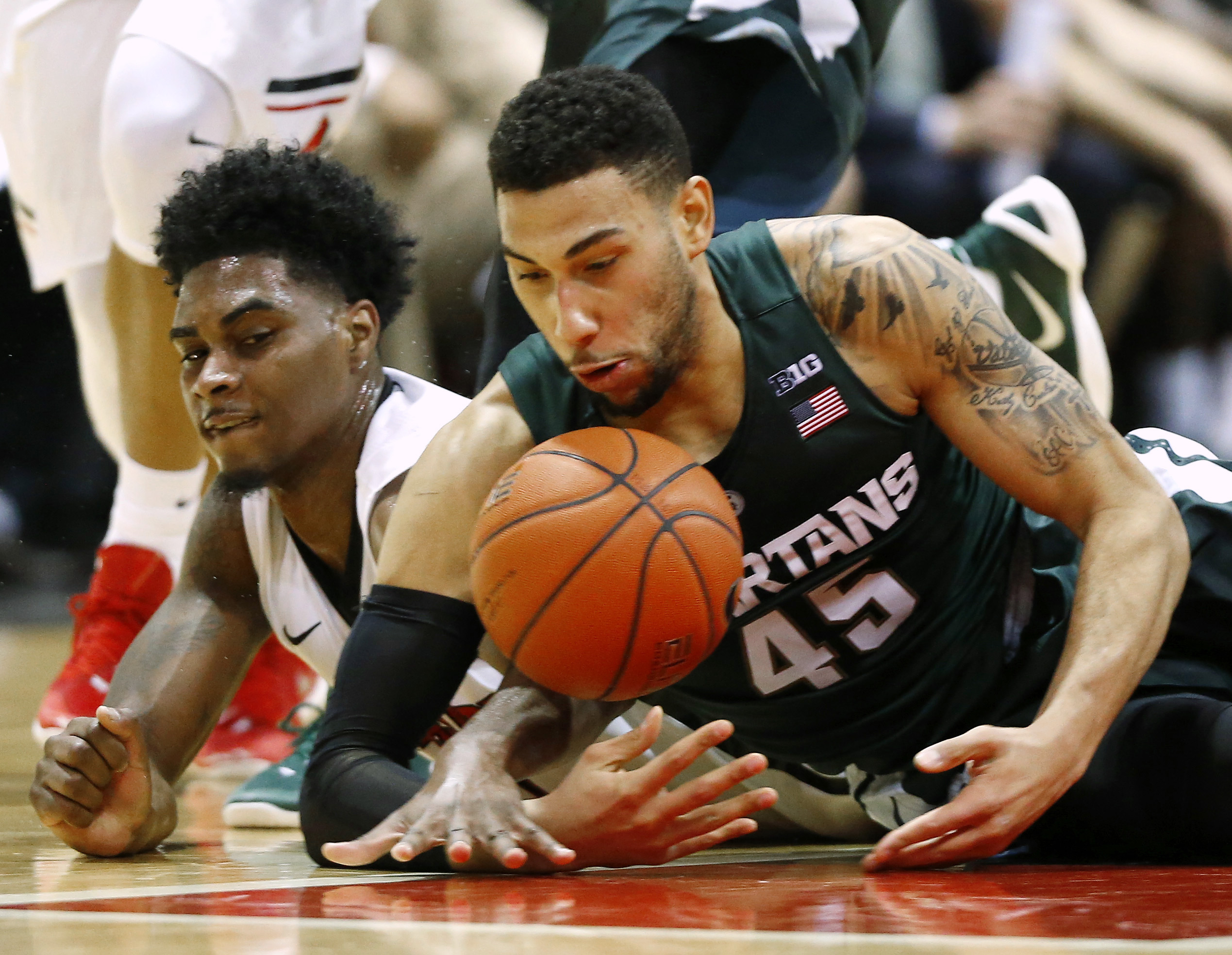 No. 1 Michigan State beats Northeastern 78-58