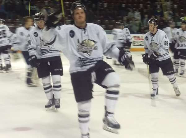 Grizzlies defenseman Corey Fienhage salutes the fans after Saturday's 6-3 victory over Colorado. (Photo: Utah Grizzlies)