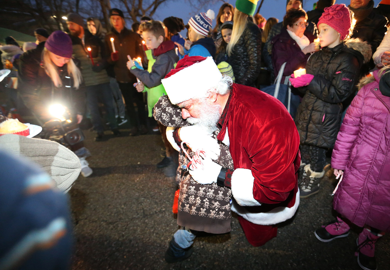 Santa hugs a youngster as Soul Food USA holds its fifth annual Christmas Chili Night for the Homeless at the Road Home in Salt Lake City on Sunday, Dec. 20, 2015. (Photo: Jeffrey D. Allred, Deseret News)