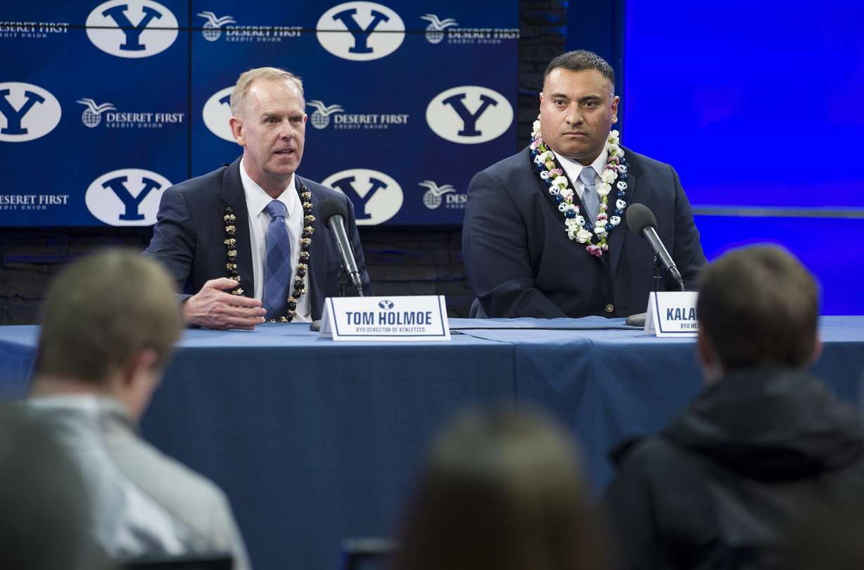 BYU's director of athletics Tom Holmoe introduces Kalani Sitake as the new head football coach at a press conference in Provo Monday, Dec. 21, 2015. (Photo: Scott G Winterton, Deseret News)