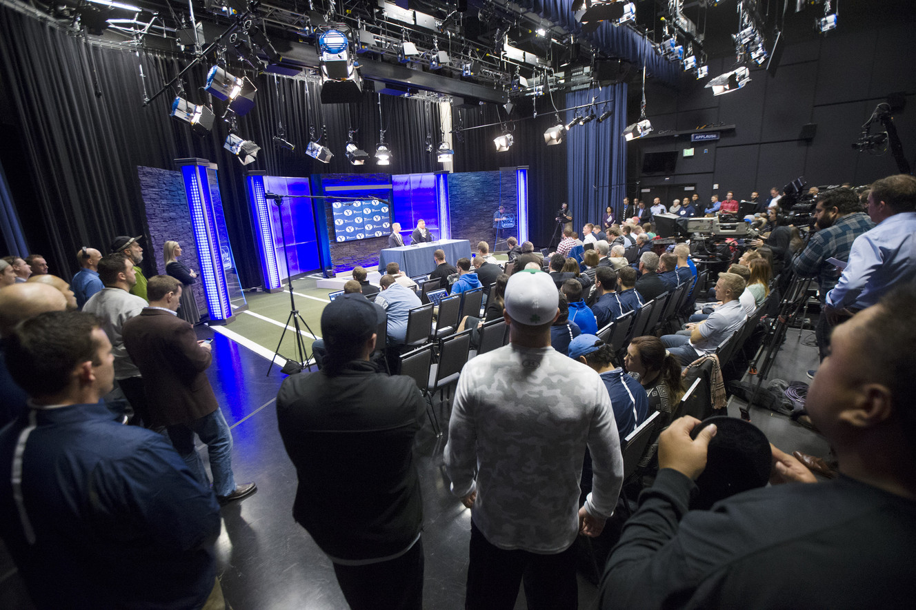 BYU's director of athletics Tom Holmoe introduces Kalani Sitake as the new head football coach at a press conference in Provo, Dec. 21, 2015. (Photo: Scott G Winterton, Deseret News)
