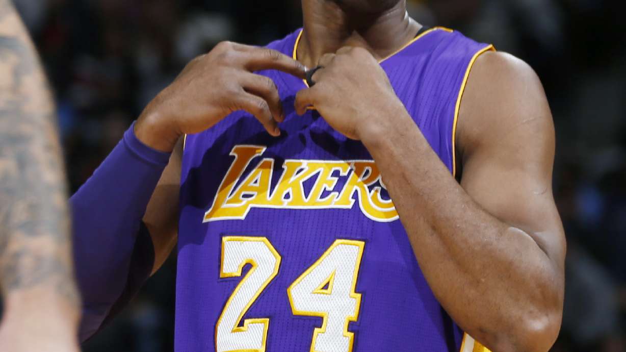 Bryant scores 31 as Lakers beat Nuggets 111-107