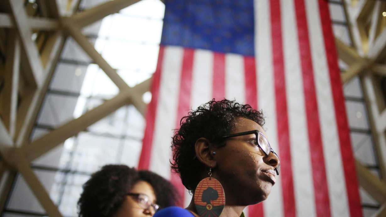 The Latest: Details emerge about airport protest arrests