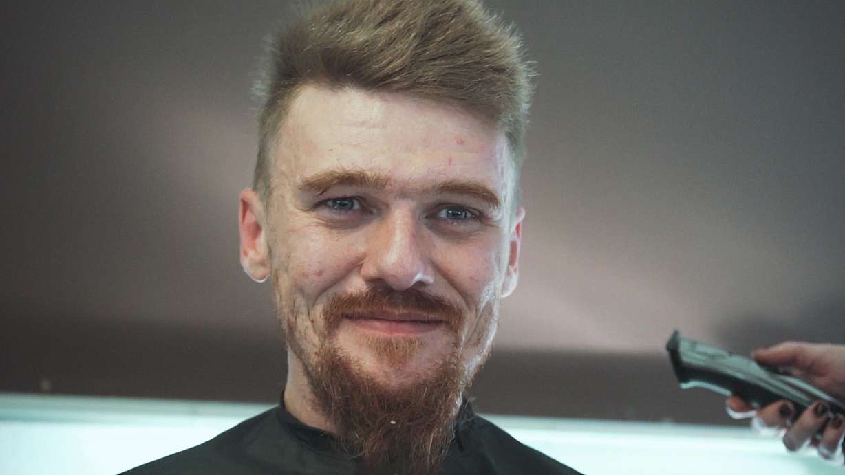 A man gets his hair cut by a volunteer stylist during Saturday's 'Haircuts for the Homeless' event held at the Ogden Rescue Mission. (Photo: Ben Taylor, Circa3)