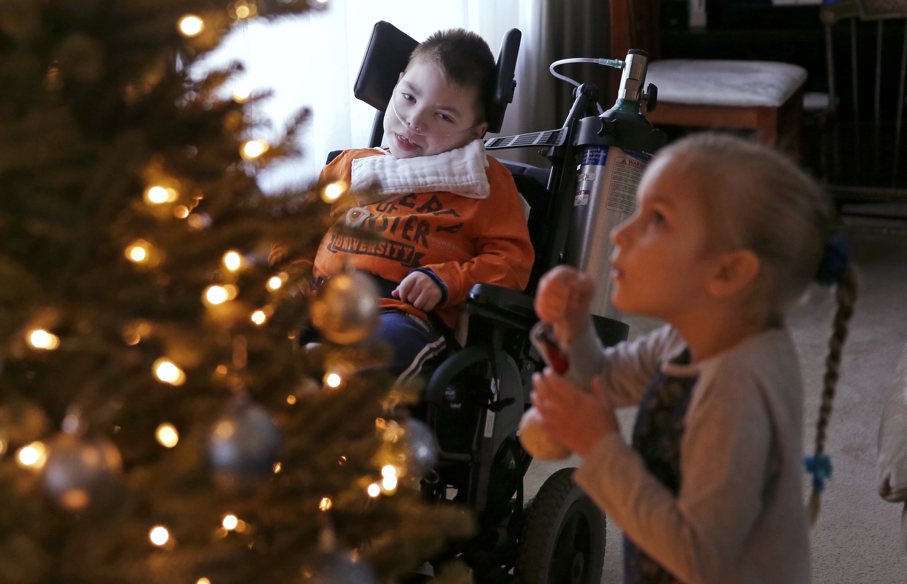 AP PHOTOS: For family of special-needs kids, special help