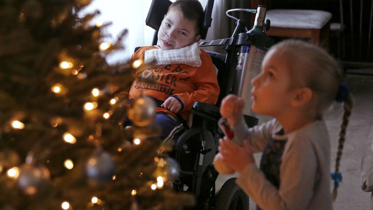 AP PHOTOS: For family of special-needs kids, special help