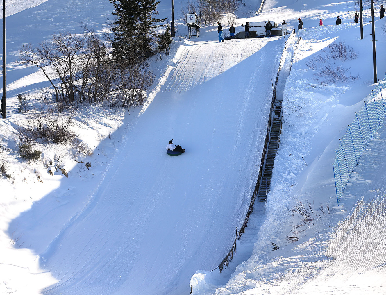 A tuber slides during extreme tubing down ski jump hills at Utah Olympic Park near Park City Saturday, Dec. 26, 2015, in Synderville Basin. (Photo: Tom Smart, Deseret News)