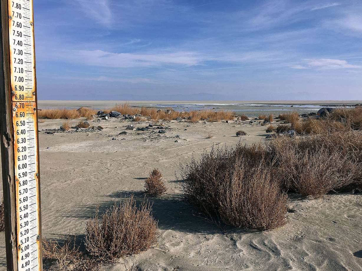 A gage to measure water levels of the Great Salt Lake stands in a dry bed at Lakeside, Utah, on Monday, Nov. 23, 2015. For the first time since it was opened in 1984, water has stopped flowing through the Great Salt Lake causeway breach, an area that allows water to travel between the southern and northern parts of the lake. (Photo: Mike Freeman)