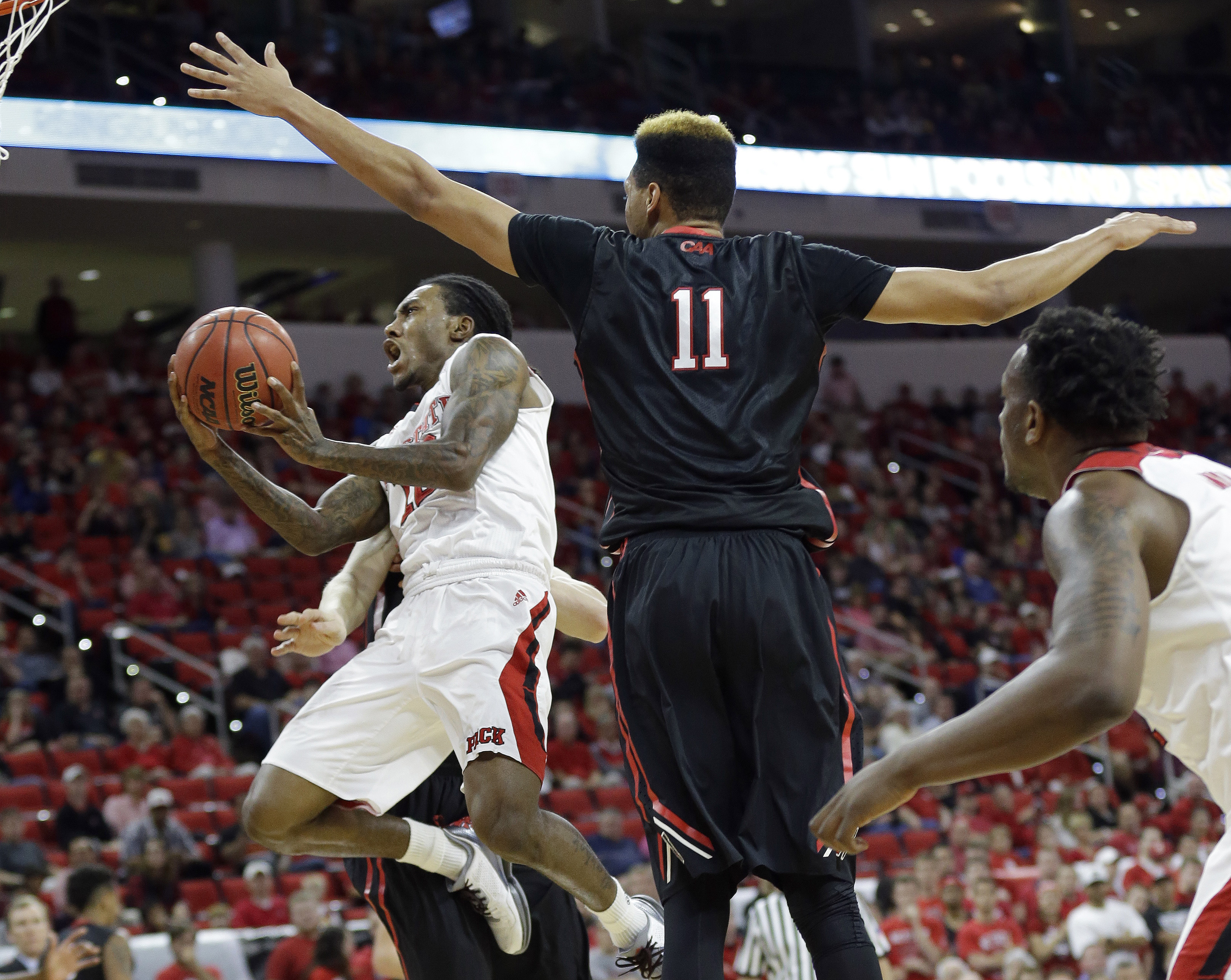 Barber, Caleb Martin lead NC State past Northeastern 72-66