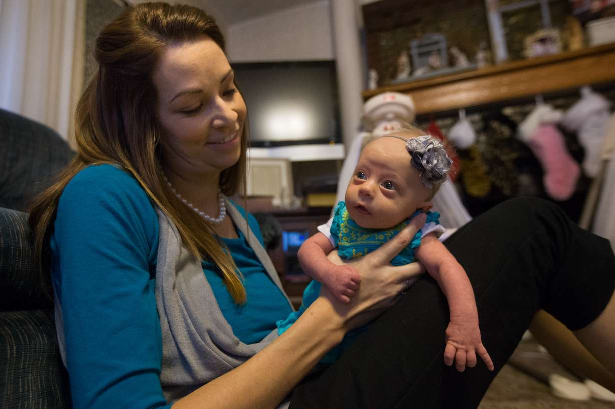 Bobbisue Christensen, holds her 6-week-old daughter, Ruthann, at their home in Brigham City on Tuesday, Dec. 29, 2015. (Photo: Scott G Winterton, Deseret News)