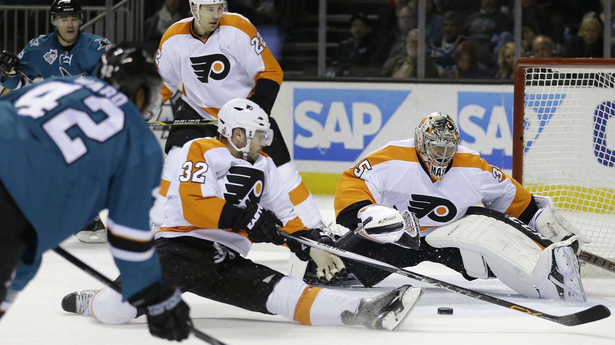 Sharks get rare home win, beating Flyers 4-2