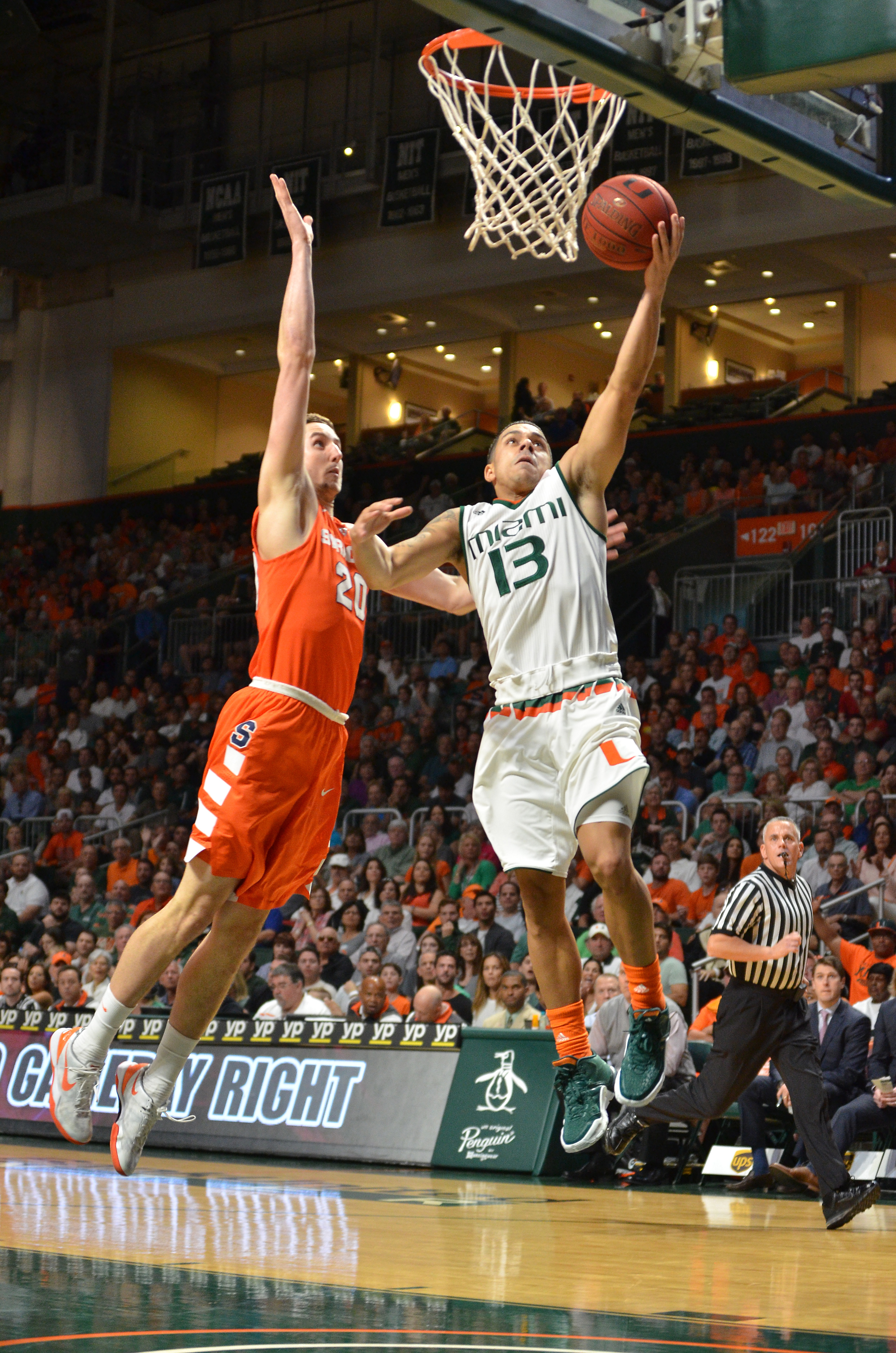 No. 13 Miami pulls away late to beat Syracuse 64-51