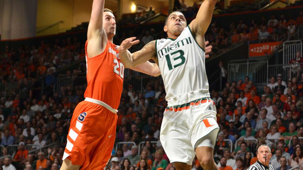 No. 13 Miami pulls away late to beat Syracuse 64-51