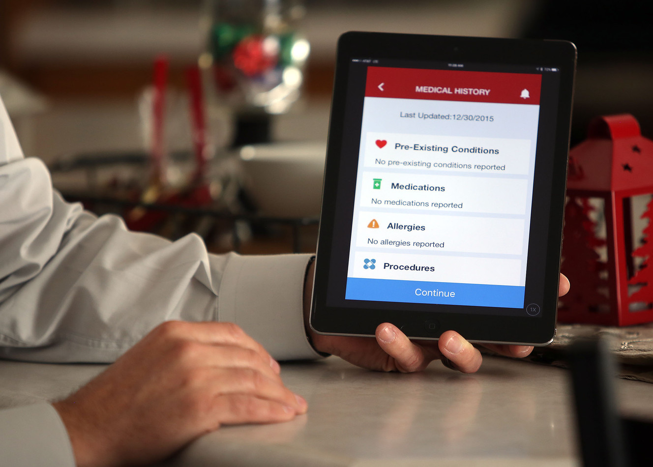 Troy Wood, vice president of business development for MountainStar Healthcare, demonstrates how to use MountainStar Virtual Care at his co-worker's home in South Jordan on Wednesday, Dec. 30, 2015. (Photo: Kristin Murphy, Deseret News)