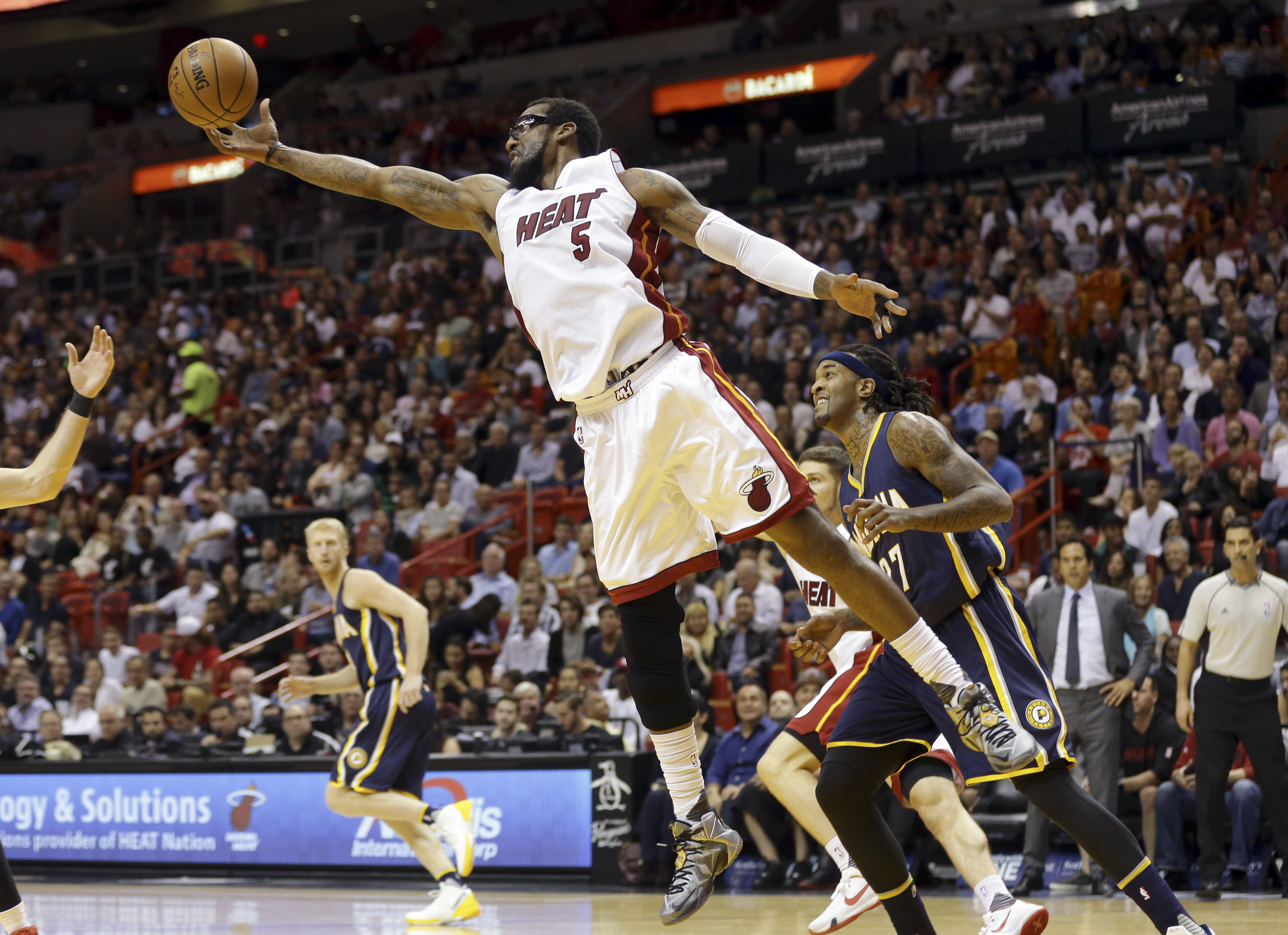 Heat rally from 18 down, top Pacers 103-100 in OT