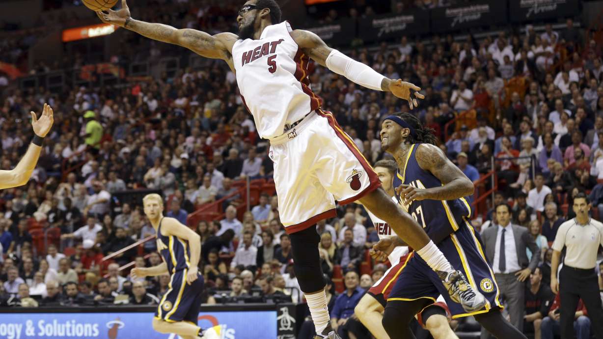Heat rally from 18 down, top Pacers 103-100 in OT