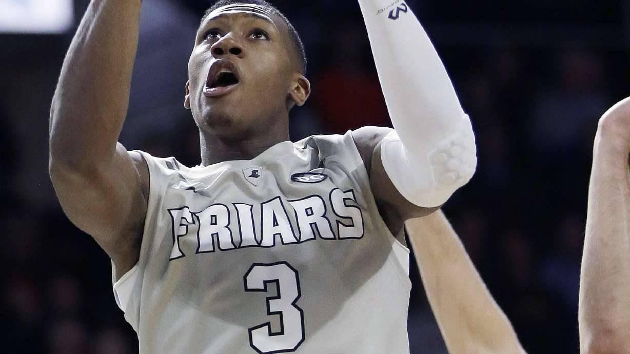 Marquette beats No. 8 Providence 65-64