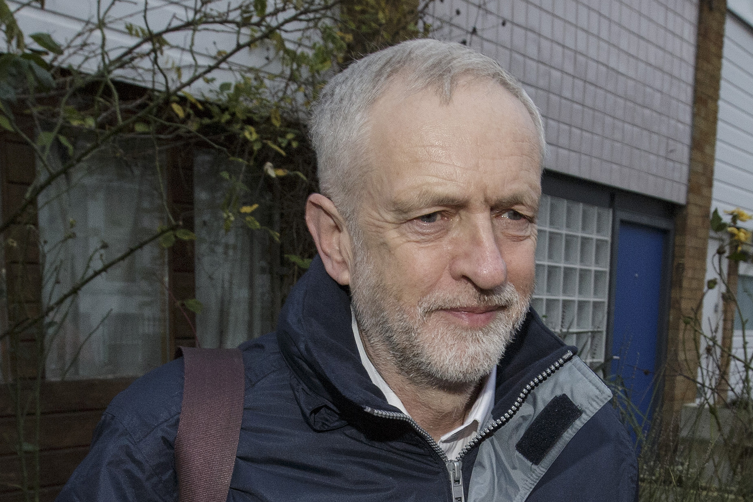 Leader of Britain's divided Labour Party fires party rebels