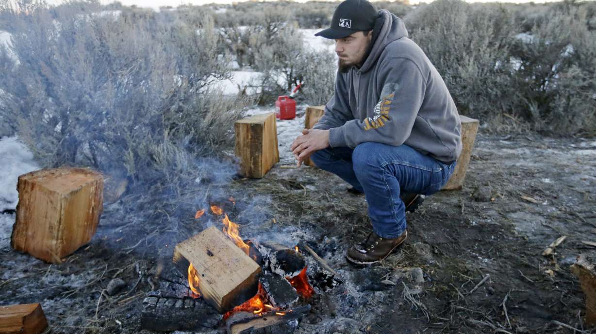 The Latest: Sheriff: Armed group needs to 'pick up and go'