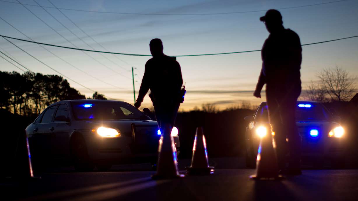 The Latest: Boy and father die after hostage standoff