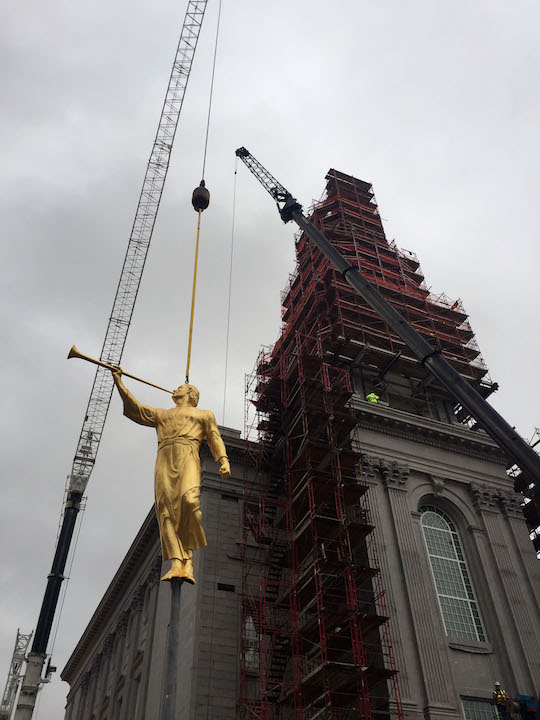 The angel Moroni is hooked to a cable, and a crane will lift the statue to the top of the Philadelphia Pennsylvania Temple. (Photo: © 2016 Intellectual Reserve, Inc. All rights reserved)