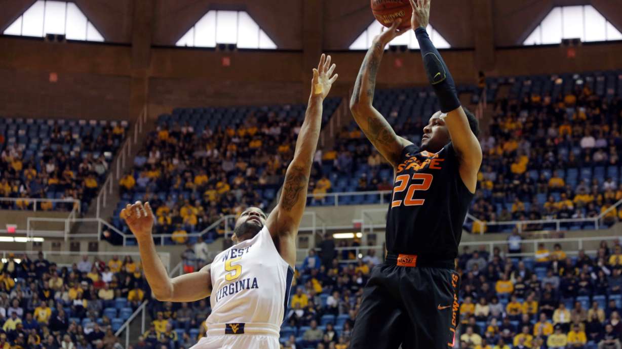 Holton, No. 17 West Virginia beat Oklahoma State 77-60