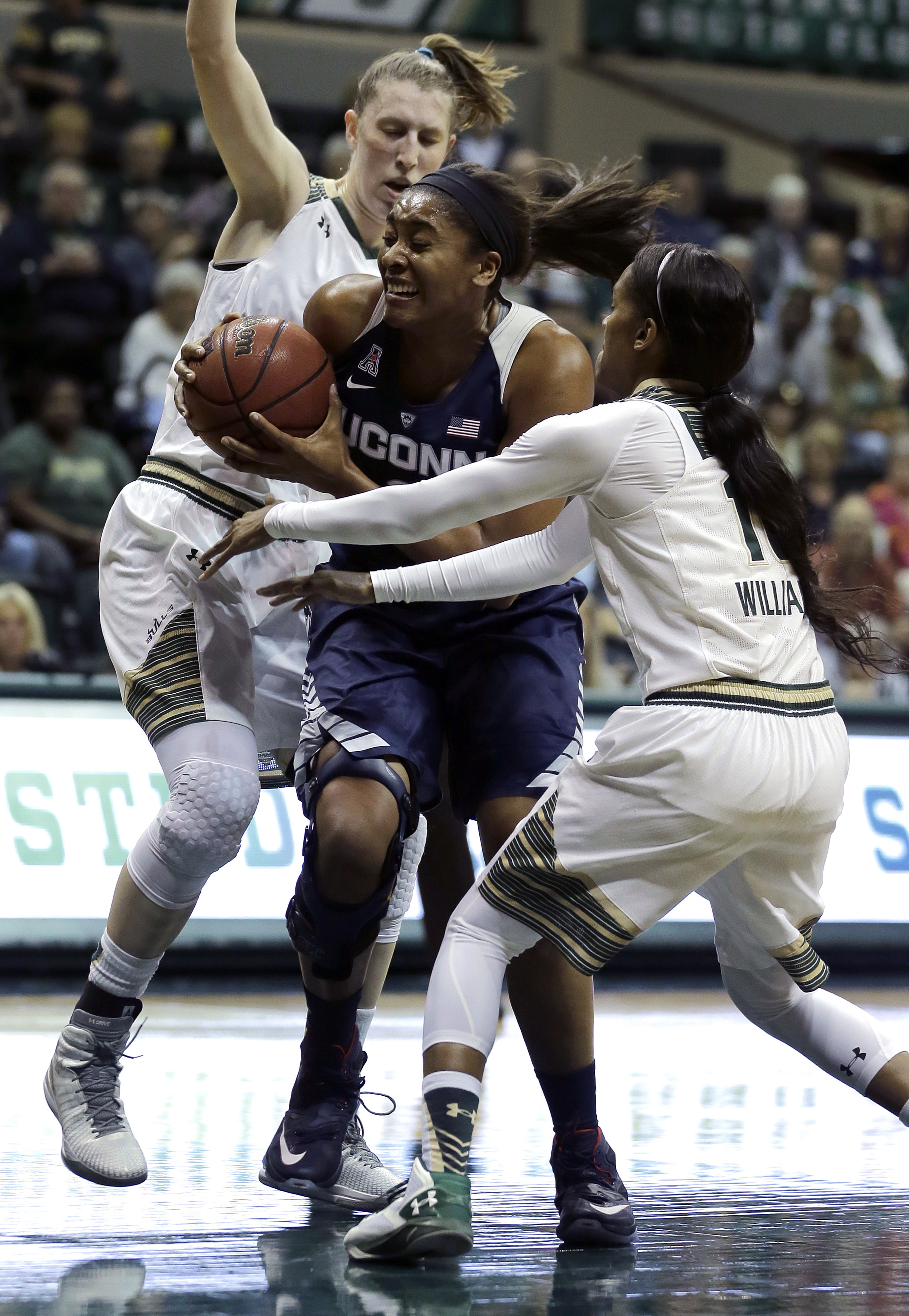 Tuck scores 22, top-ranked UConn pulls away from No. 22 USF