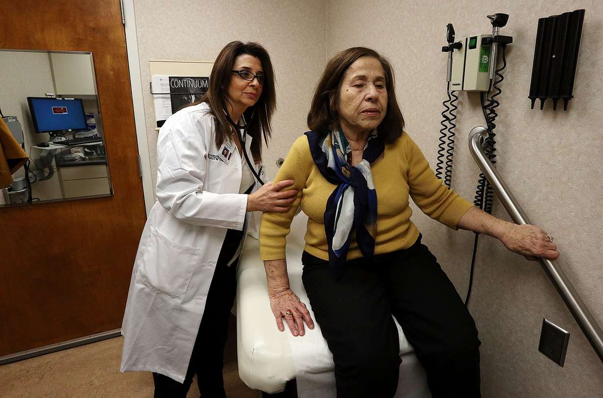 Dr. Hanadi Farrukh examines a patient at the University of Utah Madsen Health Center in Salt Lake City, Monday, Dec. 21, 2015. (Photo: Ravell Call, Deseret News)