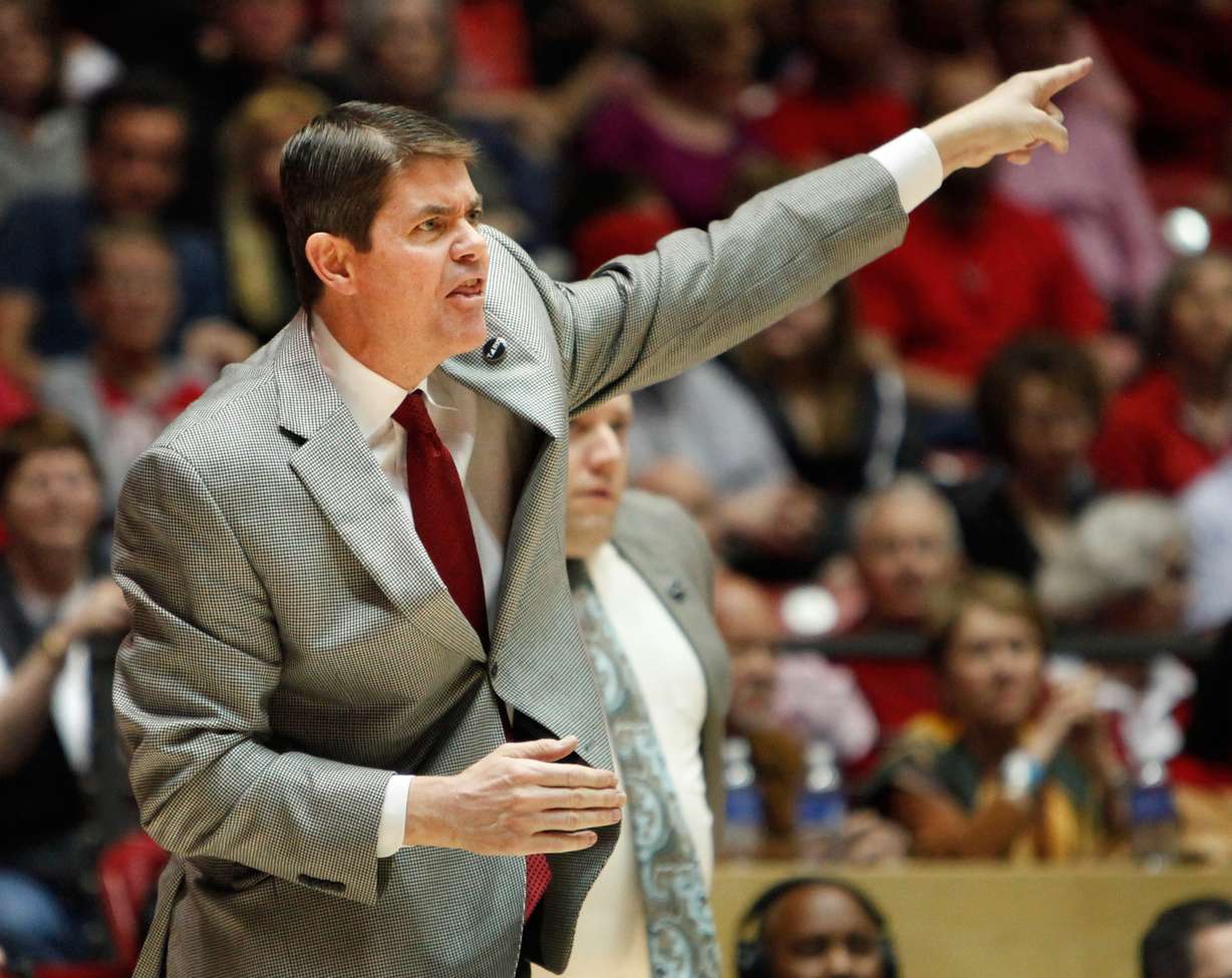 In this Feb. 21, 2015, file photo, UNLV coach Dave Rice calls a play during his team's NCAA college basketball game against New Mexico in Albuquerque, N.M. Rice has resigned in the middle of his fifth season after the struggling Runnin' Rebels lost their first three games in Mountain West play. (AP file photo)