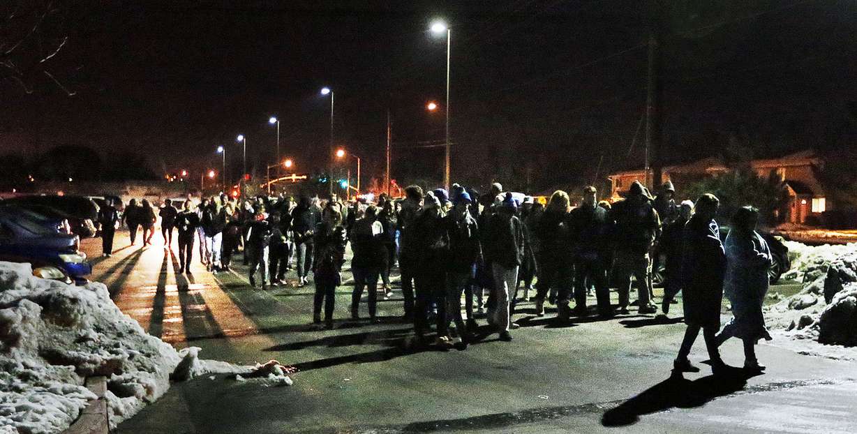 Friends and family gather during a vigil in Layton, Monday, Jan. 11, 2016 for Layton High School student BaiLee DiBernardo, who was killed when hit by a vehicle earlier in the day. (Photo: Ravell Call/Deseret News)