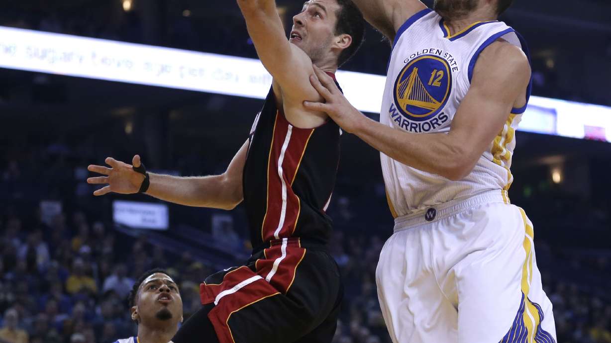 Warriors beat Heat 111-103 for 36th straight home win
