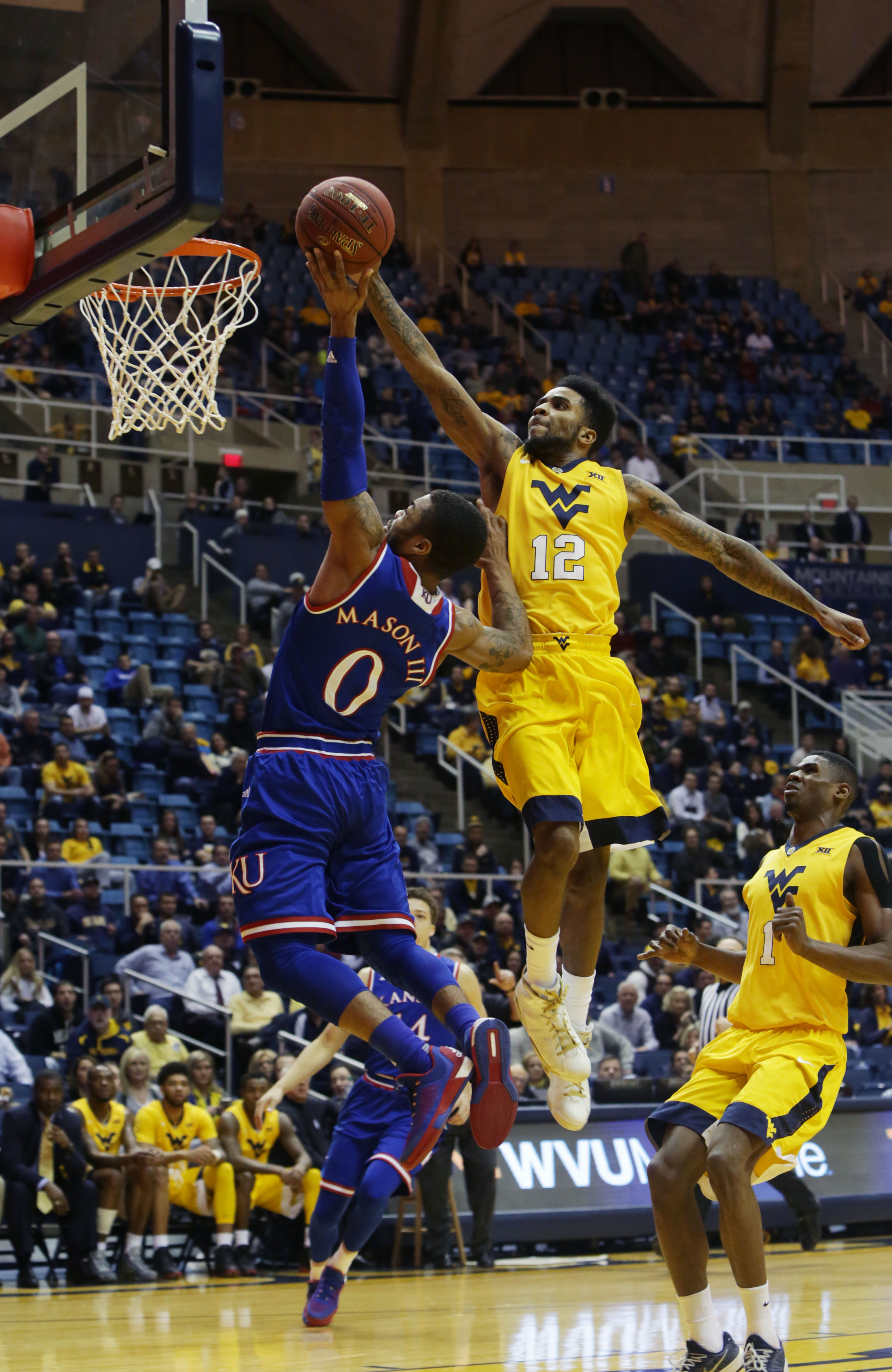 No. 11 West Virginia trips up No. 1 Kansas 74-63