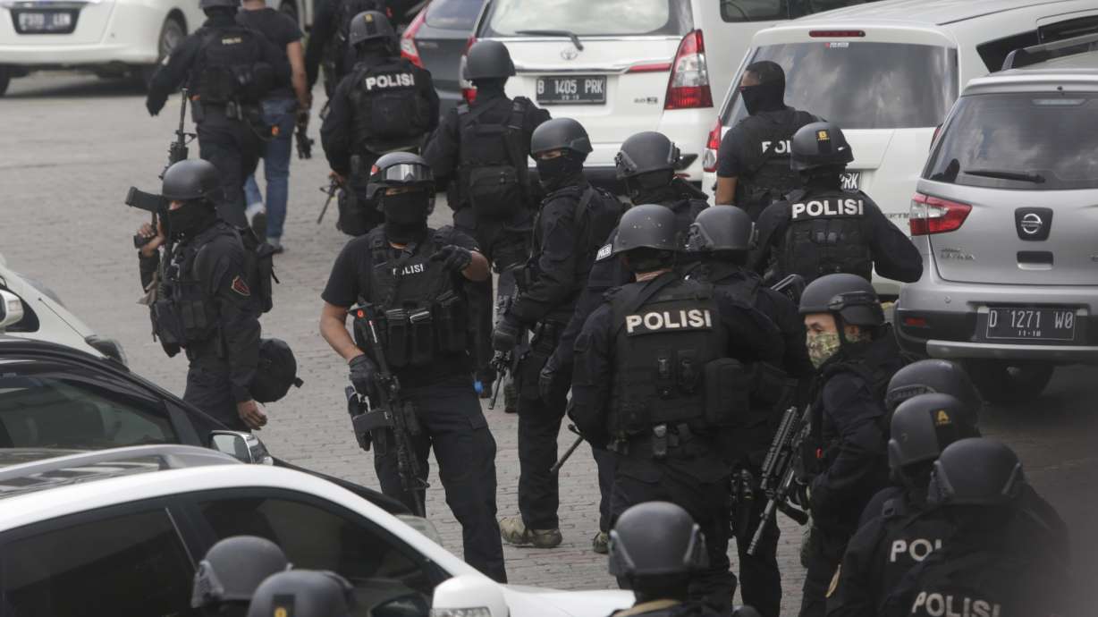 The Latest: Police say black IS flag was on Jakarta attacker