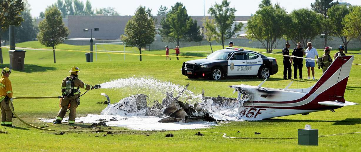 West Jordan emergency crews respond Sunday, Aug. 10, 2014, to a plane crash at the Soccer Complex, 4000 West 7965 South. A plane carrying a family of 3 from Boise, Idaho, crashed on takeoff from the South Valley Regional Airport, two people were transported by air ambulance, the third by ground ambulance.
(Photo: Scott G Winterton, Deseret News)