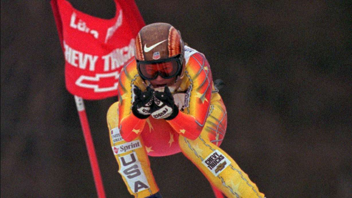 The Latest: 911 call released in ex-Olympian's assault case