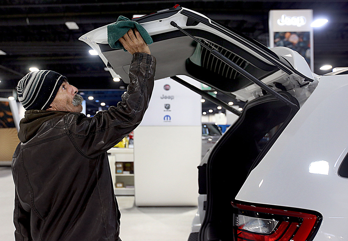 Joaquin Hernandez cleans a Dodge Durango on Thursday, Jan. 14, 2016, in preparation for the for the 2016 Utah International Auto Expo at the South Towne Expo Center in Sandy. The expo runs Jan. 15-18, 2016. (Photo: Laura Seitz, Deseret News)