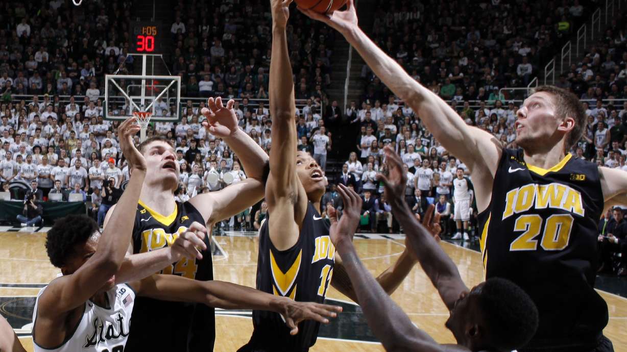 No. 16 Iowa routs No. 4 Michigan State 76-59, sweeps series