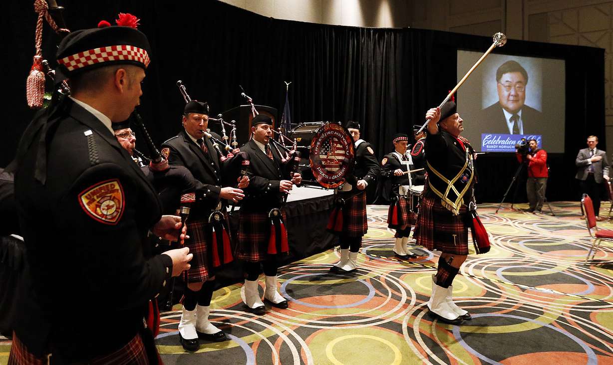 The Unified Fire Authority Pipe and Drum Corp participates in a flag ceremony at the beginning of a memorial service for Randy Horiuchi in Salt Lake City, Friday, Jan. 15, 2016. (Photo: Ravell Call, Deseret News)
