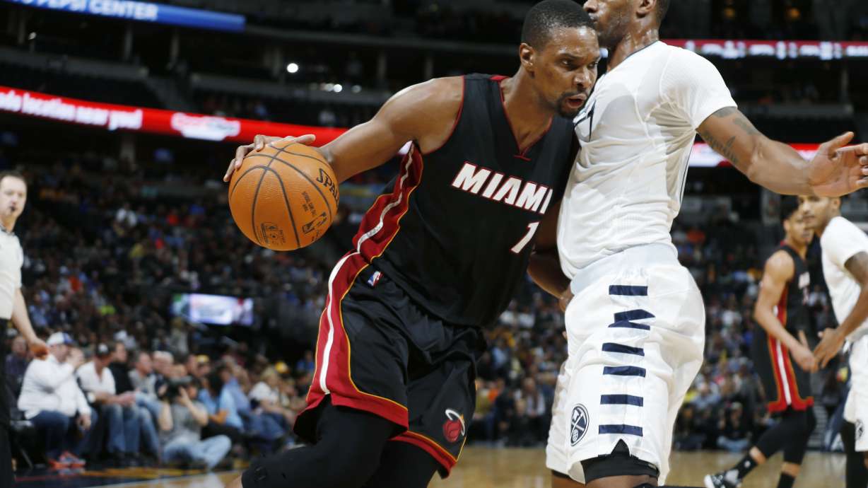 Whiteside's triple-double rallies Heat past Nuggets, 98-95