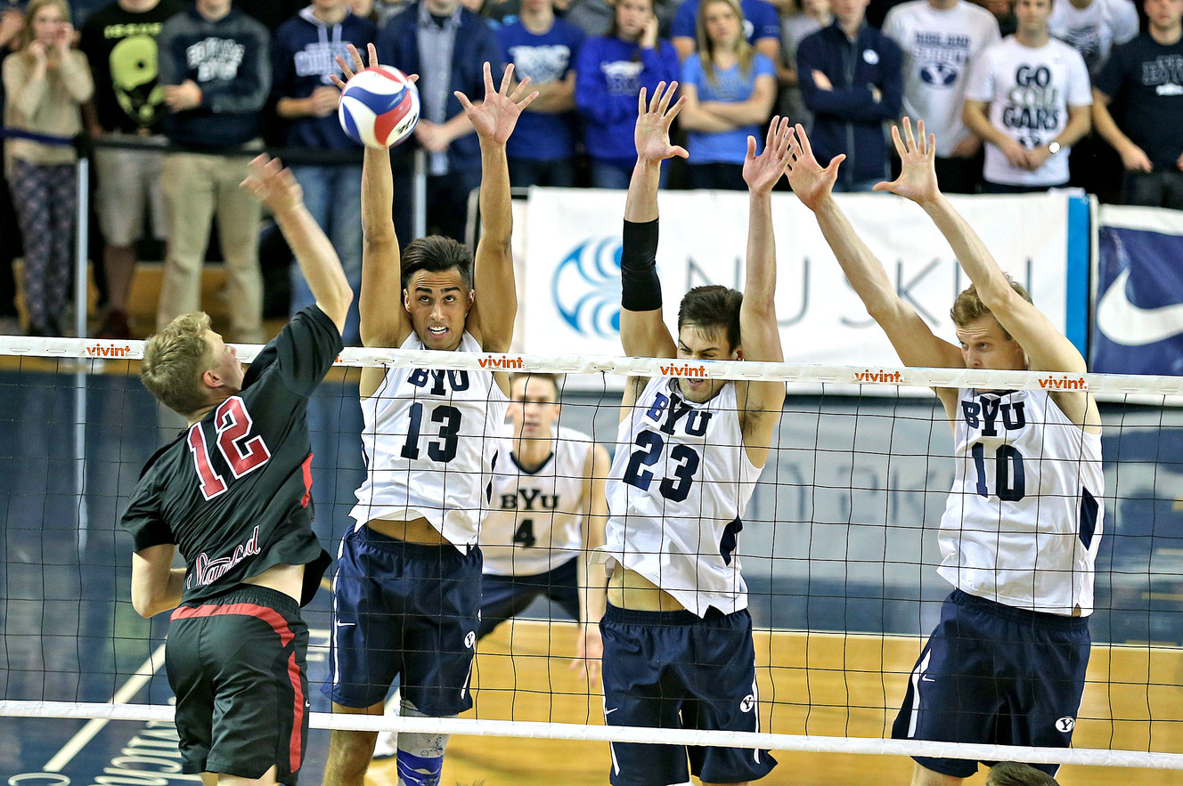 BYU's Ben Patch, Michael Hatch and Jake Langlois, left to right defend a shot by Stanford's Jordan Ewert as the 11th ranked Stanford Cardinal defeats the top-ranked BYU men's volleyball team, 3-2, Friday, Jan. 15, 2016, in Provo. (Photo: Tom Smart, Deseret News)