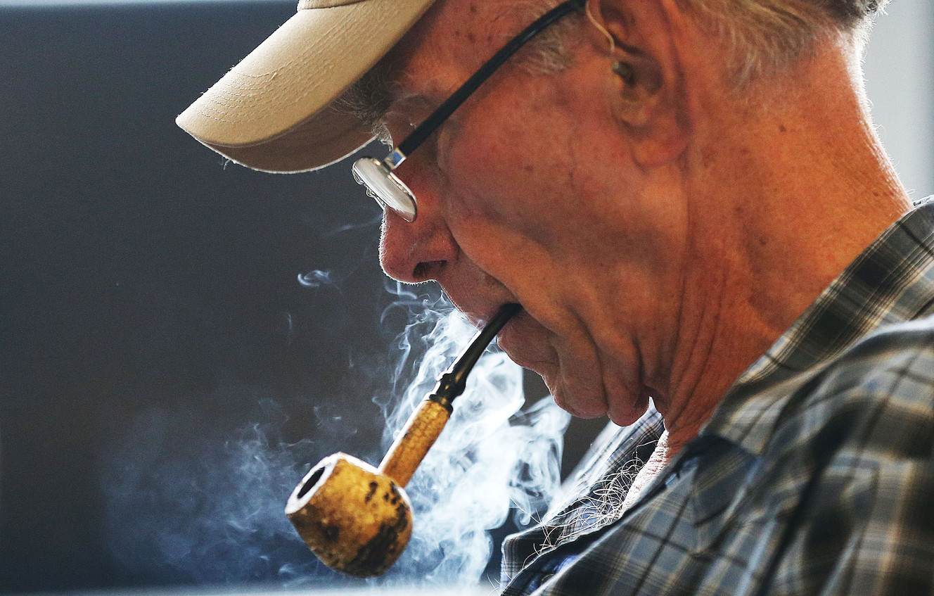 Steve Million uses a smoking room at Salt Lake City International Airport on Monday, Aug. 3, 2015. (Photo: Ravell Call, Deseret News)