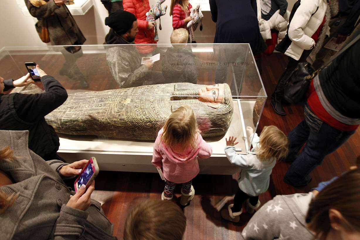 Guests look at a mummy at the Long Live Art kickoff festival at the Utah Museum of Fine Arts at the University of Utah in Salt Lake City, Saturday, Jan. 16, 2016. The museum will close after Sunday for one year for renovations. (Photo: Chris Samuels, Deseret News)