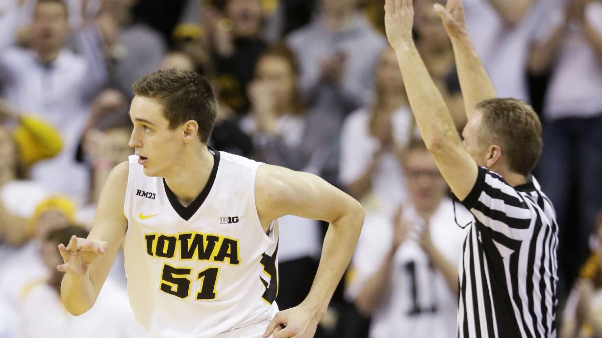 No. 16 Iowa beats Michigan 82-71