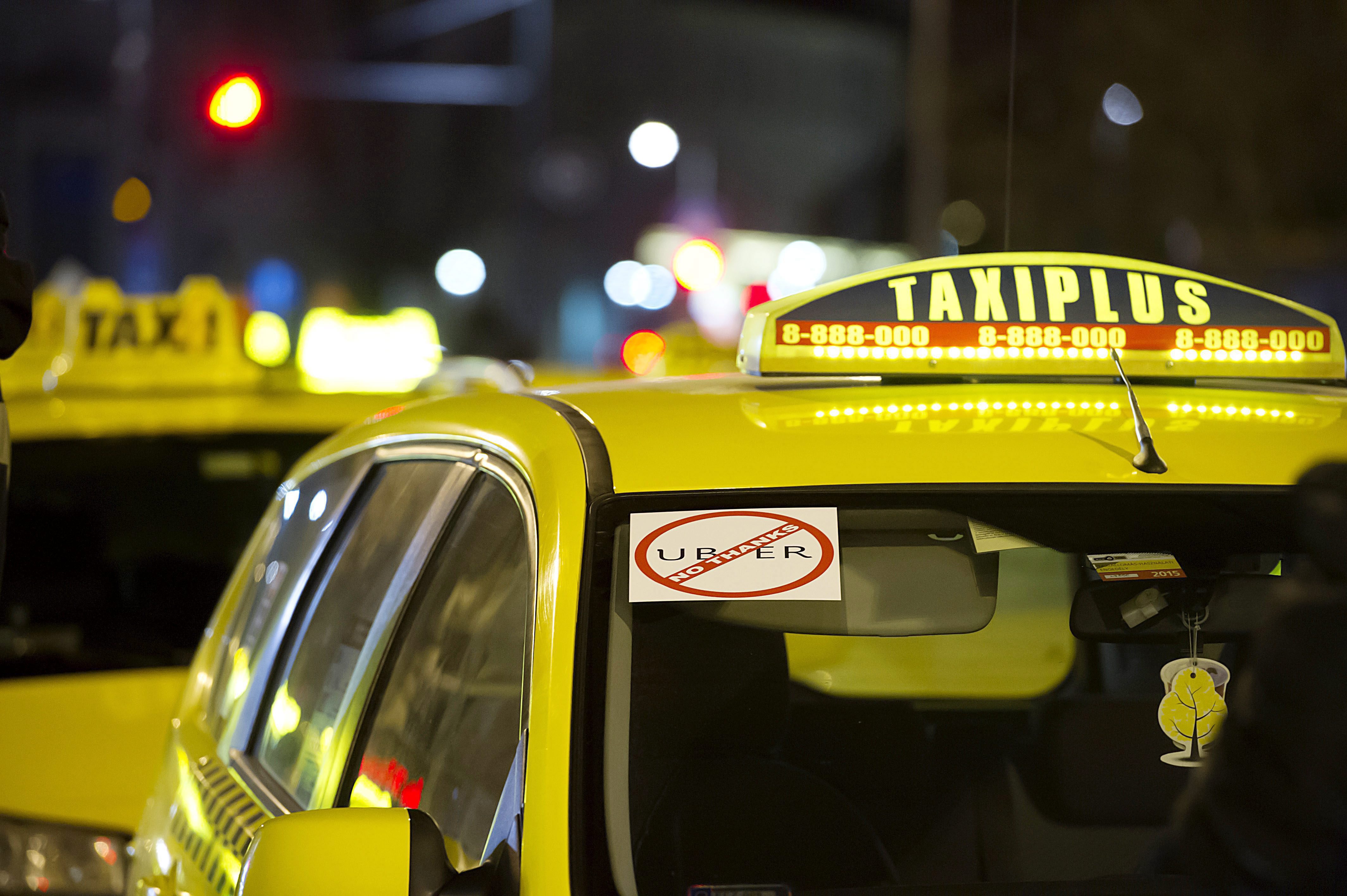 Taxis in Budapest block traffic, demand ban on Uber