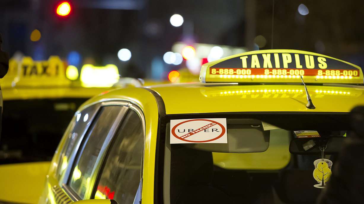 Taxis in Budapest block traffic, demand ban on Uber