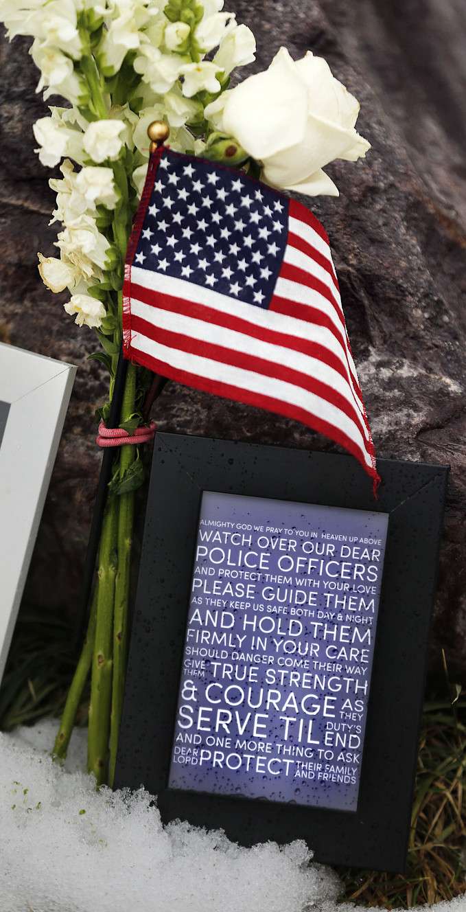 A memorial is shown Monday, Jan. 18, 2016, near the scene in Holladay where Unified police officer Doug Barney was fatally shot Jan. 17, 2016. (Photo: Ravell Call, Deseret News)