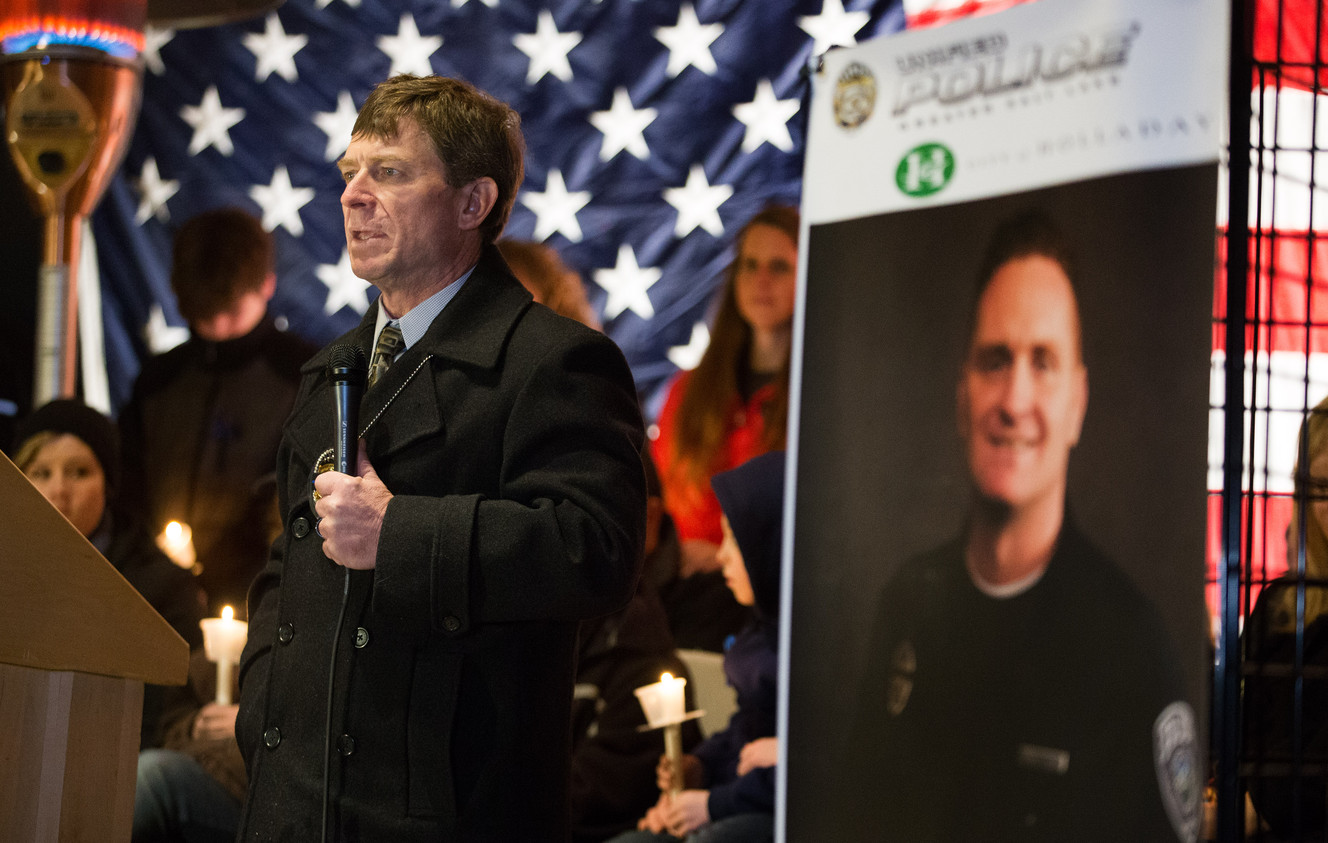 Wounded officer Jon Richey talks about his partner, Doug Barney, as hundreds turn out to show respect and support for him and Barney and his family at a vigil at Holladay City Hall on Wednesday, Jan. 20, 2016. (Photo: Scott G Winterton, Deseret News