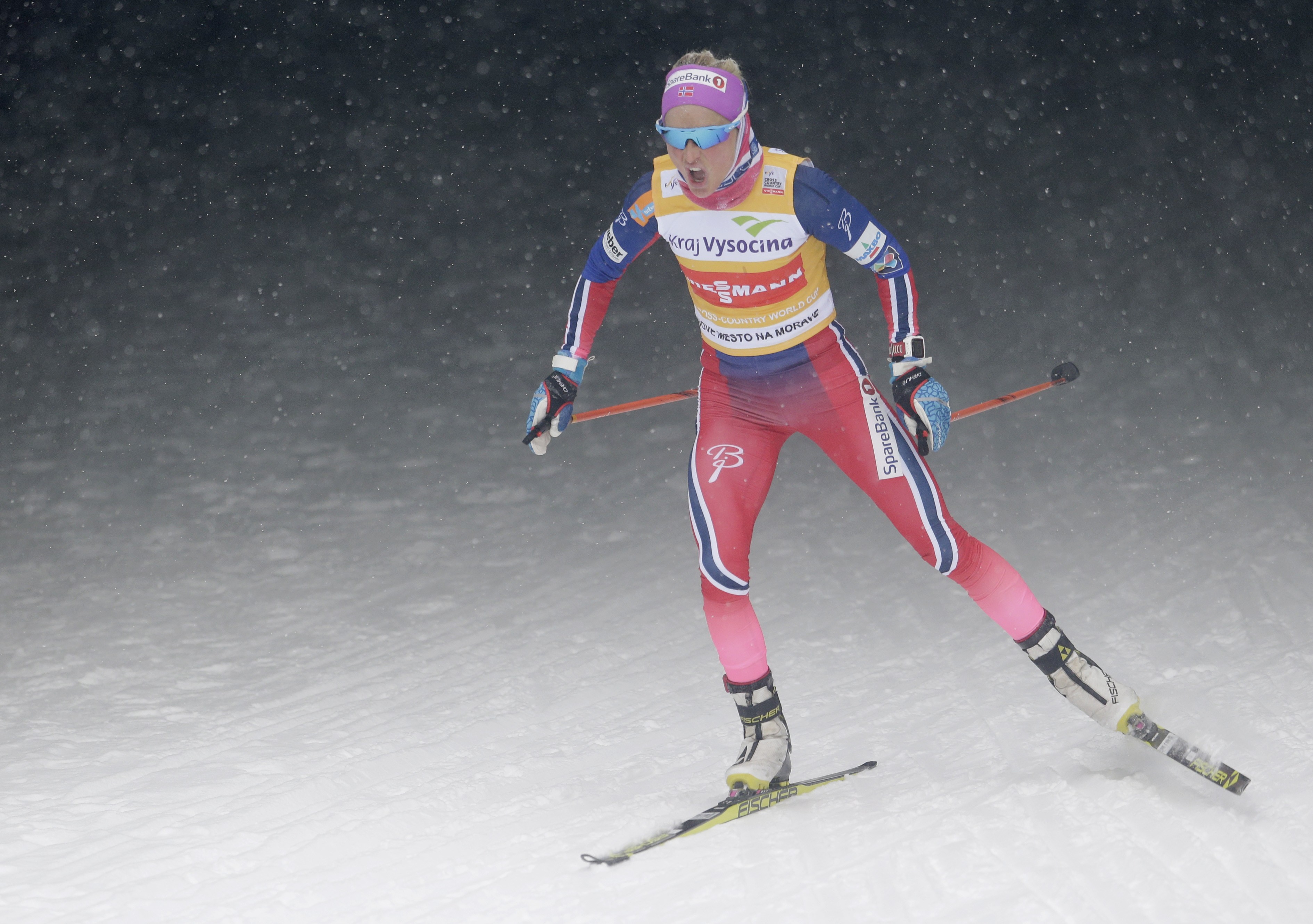 Johaug, Manificat win free style cross-country World Cup
