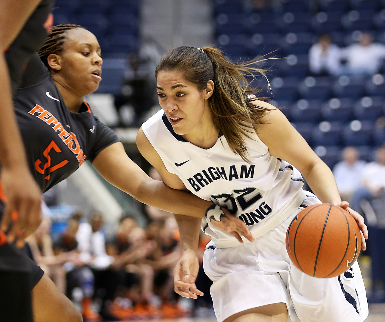 BYU forward Kalani Purcell (32) drives the lane on Pepperdine guard/forward Keitra Wallace (51) as BYU and Pepperdine women play at the Marriott Center in Provo, Jan. 23, 2016. BYU won 69-64. (Photo: Scott G Winterton, Deseret News)